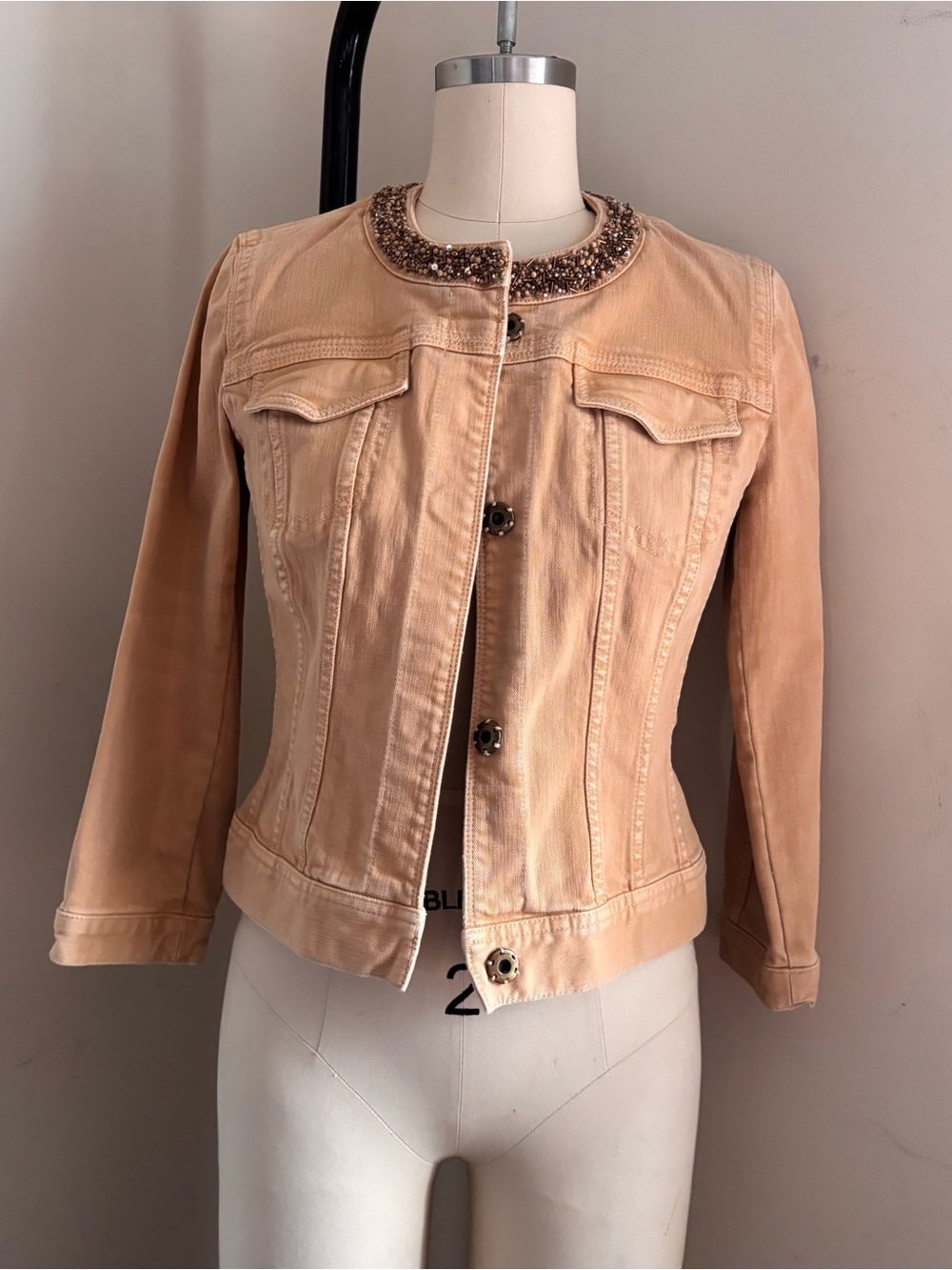 Beige denim jacket with beaded collar